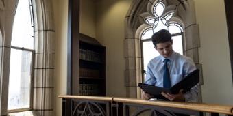 Student reading in the Cathedral of Learning